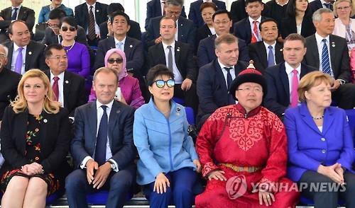 President Park Geun-hye (3rd from L) and other leaders watch Mongolia's annual "Naadam Festival" in Ulaanbaatar after the first round of the Asia-Europe Meeting summit on July 15, 2016.
