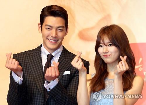 Kim Woo-bin (L) and Suzy Bae of the KBS TV series "Uncontrollably Fond" pose for a photo during a press conference for the drama in Seoul on July 4, 2016. 