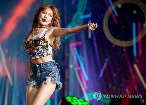 South Korean idol singer HyunA performs on stage at the finale of Viral Fest Asia 2016 in Bali, Indonesia, on July 16, 2016.