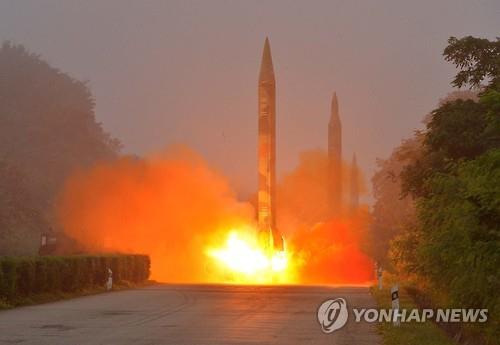 In this photo, released by the North's state-run Rodong Sinmun newspaper on July 19, 2016, one of three ballistic missiles is being launched in Hwangju, south of Pyongyang.(For Use Only in the Republic of Korea. No Redistribution)