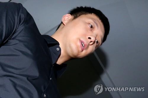 Park Yu-chun, the troubled member of popular K-pop boy band JYJ, appears at the Gangnam Police Station in southern Seoul on June 30, 2016, to face questioning over sexual assault allegations. After a month-long investigation, police cleared Park of the allegations but said he is suspected of having sex with a woman and promising some sort of compensation, though it was not kept.