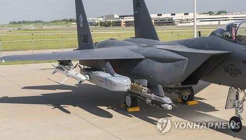 n this photo taken on Aug. 9, 2016, a Taurus air-to-surface cruise missile is installed on a U.S. F-15E fighter jet at an overseas airport.