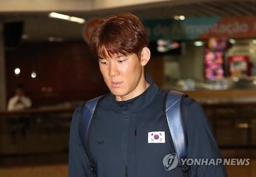 South Korean swimmer Park Tae-hwan walks through Galeao International Airport in Rio de Janeiro after completing his fourth Olympics in the Brazilian city on Aug. 11, 2016. 