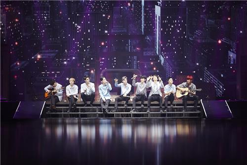In this photo released by S.M. Entertainment, South Korean boy group EXO performs during the group's Seoul concert "EXO Planet #3 - The EXO'rDIUM" at Olympic Park stadium, southeastern Seoul, on July 24, 2016. 