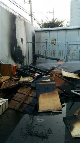 A wall at the Japanese Consulate compound in Busan, 453 kilometers southeast of Seoul, is blackened from an early morning fire on Aug. 18, 2016, in this photo provided by the Dongbu Police Station in Busan.