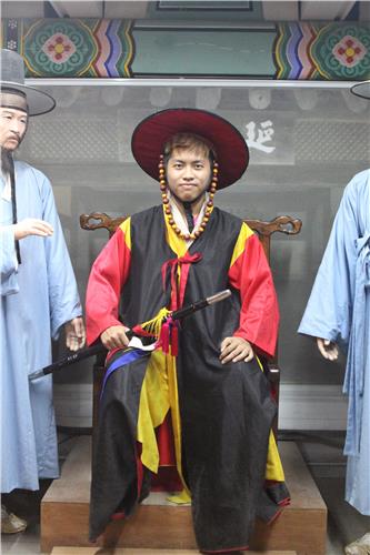 This photo, released by the Ministry of Gender Equality and Family, shows Israel Ying Ding, a 19-year-old Burmese participant of the Youth Camp for Asia's Future 2016, visiting tourist attractions in Seoul in August 2016.