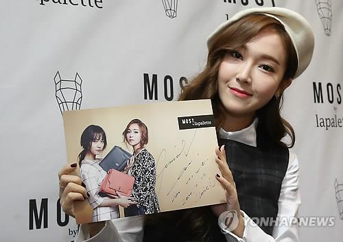 South Korean singer Jessica poses for a photo during a fan meeting in Seoul on Dec. 6, 2014, to promote the brand lapalette.