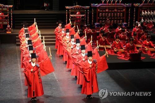 A troupe from the National Gugak Center performs during rehearsal at the center in Seoul on June 11, 2015, for Jongmyo Jeryeak, the ritual music played in ceremonies at two shrines dedicated to the 19 kings of the Joseon Dynasty (1392-1910) and the 15 people of exceptional merit from the royal family.