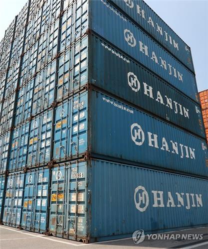 Hanjin Shipping Co.'s container boxes are stacked at a port yard in Busan on Sept. 1, 2016. 