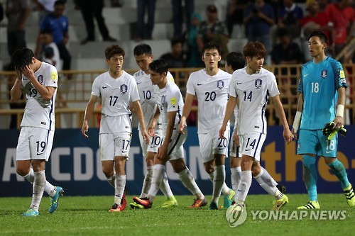 South Korean players walk off the field after a scoreless draw with Syria in their Asian World Cup qualifying match at Tuanku Abdul Rahman Stadium in Seremban, Malaysia, on Sept. 6, 2016.