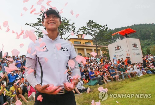 In this photo provided by the Korea LPGA Tour, South Korean golfer Park Sung-hyun celebrates her KLPGA victory at the Hanhwa Finance Classic at Golden Bay Golf Course in Taean, South Korea, on Sept. 4, 2016. 