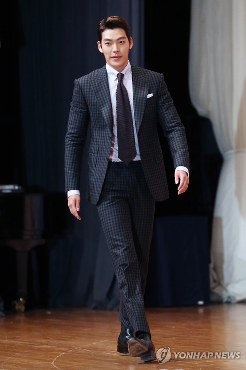South Korean actor Kim Woo-bin walks onto the stage during a press conference for KBS 2TV's new drama "Uncontrollably Fond" on July 4, 2016.