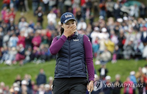 In this Associated Press photo, Chun In-gee of South Korea reacts to her victory at the Evian Championship on the LPGA Tour in Evian-les-Bains, France, on Sept. 18, 2016.