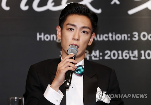 BigBang's T.O.P speaks during a news conference in Seoul on Sept. 19, 2016, for "#TTTOP," a charity auction set to open on Oct. 3 in Hong Kong. The singer-rapper is taking part in the auction as a curator.