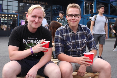 Alexsi Toivonien (R) and Teemu Lahtinen, students from Finland who are studying at Konkuk University, pose for a photo during the Beer Week Seoul festival on Sept. 21, 2016. 