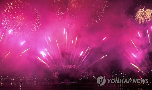 Fireworks go off at Yeouido Park by the Han River in Seoul during the ceremony commemorating the 500-day countdown to the 2018 PyeongChang Winter Olympics on Sept. 27, 2016. 