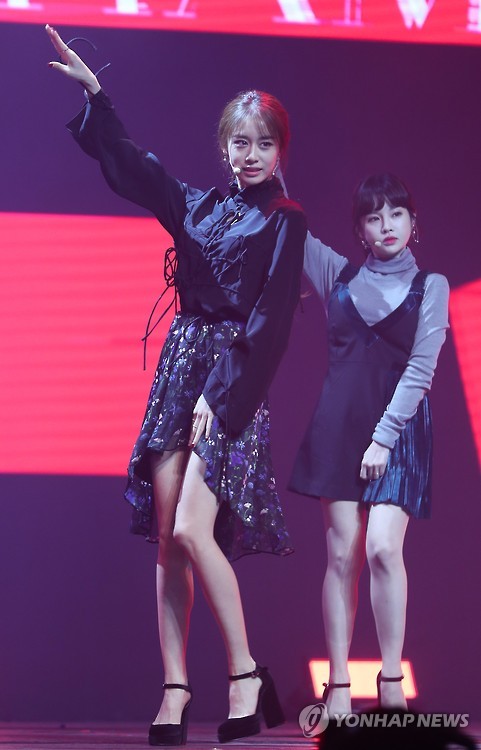 Jiyeon (L) and Boram of South Korean girl group T-ara perform at the media showcase for their 12th and latest EP "Remember" in central Seoul on Nov. 9, 2016.