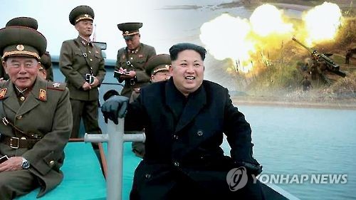 This undated captured image from Yonhap News TV shows North Korean leader Kim Jong-un and his officials during a field visit to a military drill in the West Sea.