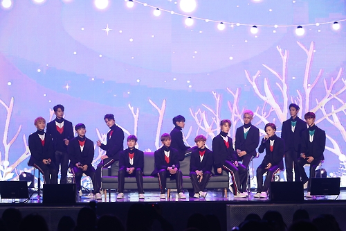 The photo, provided by Pledis Entertainment, shows South Korean boy band Seventeen performing pop-ballad "Smile Flower," a song from its third and latest EP "Going Seventeen," in central Seoul on Dec. 5, 2016.