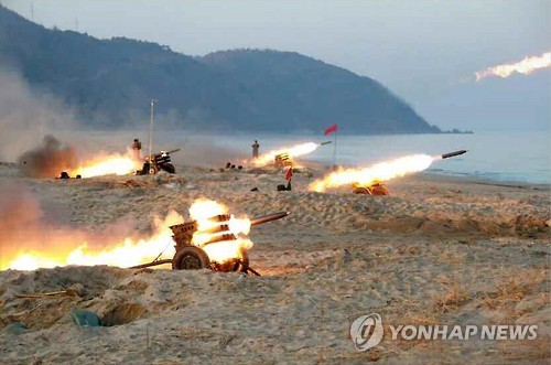 North Korean leader Kim Jong-un observes a firing contest by multiple launch rocket system (MLRS) batteries in this photo unveiled by the Rodong Sinmun, North Korea's main newspaper on Dec. 21, 2016. (For Use Only in the Republic of Korea. No Redistribution)