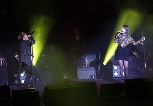 This image, provided by YG Entertainment, shows South Korean duo band Akdong Musician performing its hit tracks at Mercedes-Benz Arena in Shanghai on Dec. 22. 2016.