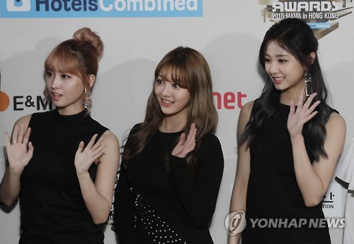 In this AP photo, Tzuyu (1st from R) and two other members of South Korean girl group TWICE pose for photos on the red carpet of the 2016 Mnet Asian Music Awards (MAMA) in Hong Kong on Dec. 2, 2016.