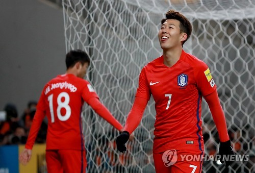 In this file photo taken on Nov. 15, 2016, South Korean forward Son Heung-min (R) reacts after missing a goal opportunity during the 2018 FIFA World Cup Asian qualifiers against Uzbekistan at Seoul World Cup Stadium in Seoul.