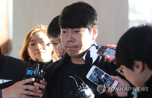 In this file photo taken on Dec. 6, 2016, Kang Jung-ho, South Korean infielder for the Pittsburgh Pirates, arrives at Gangnam Police Station in southern Seoul to face questioning over allegations he fled the scene after causing a traffic accident while driving under the influence of alcohol earlier in the month.