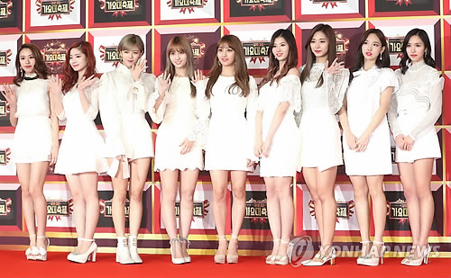 Girl group TWICE poses for photos at the 2016 KBS Music Festival in Seoul on Dec. 29, 2016.