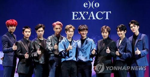 In this file photo, South Korean boy group EXO poses for the camera during a showcase to promote the release of its third album "EX'ACT" in Seoul on June 8, 2016.