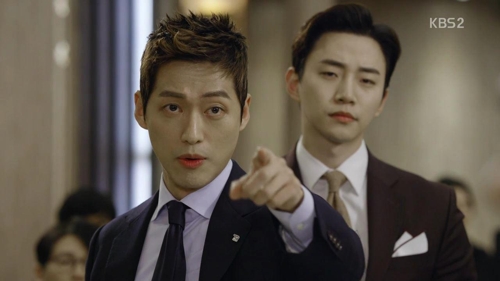 This image captured from the finale of "Good Manager" shows lead actors Namkoong Min (L) and Junho of idol group 2PM. (Yonhap)