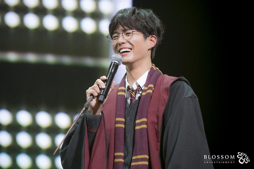 In this photo provided by Blossom Entertainment, Park Bo-gum smiles in a Harry Potter costume during a fan meeting at Seoul's Kyunghee University on March 11, 2017.