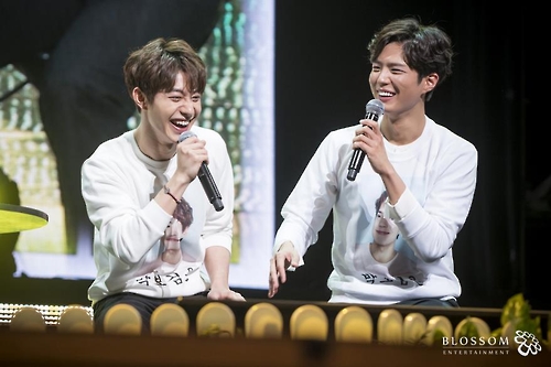 In this photo provided by Blossom Entertainment, Park Bo-gum (R) smiles during a fan meeting at Seoul's Kyunghee University on March 11, 2017