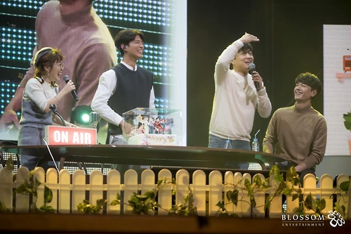 In this photo provided by Blossom Entertainment, Park Bo-gum (2nd from R) smiles during a fan meeting at Seoul's Kyunghee University on March 11, 2017.