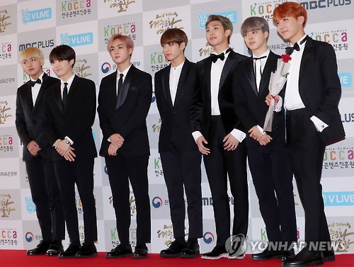 In this file photo, South Korean boy group BTS, also known as Bangtan Boys, poses at the 2016 Korea Pop Culture Arts Awards ceremony at the national theater in Seoul on Oct. 27, 2016.
