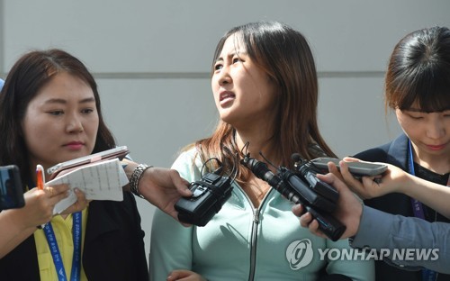 Chung Yoo-ra, the daughter of former South Korean President Park Geun-hye's close friend, speaks at Incheon International Airport, west of Seoul, on May 31, 2017, after being extradited from Denmark a day earlier. The 21-year-old Chung, who had been held at a detention center in the northern Danish city of Aalborg since January, was taken to the prosecutors' office in Seoul for questioning over allegations she received undue academic and financial favors based on her mother Choi Soon-sil's ties with the former president. (Yonhap)