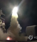 The USS Ross fires a tomahawk missile on April 7, 2017, from the Mediterranean Sea. The United States blasted a Syrian air base with a barrage of cruise missiles in retaliation for an alleged chemical weapons attack against civilians. (AP-Yonhap)