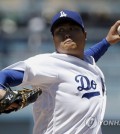 In this Associated Press photo, Ryu Hyun-jin of the Los Angeles Dodgers throws a pitch against the Philadelphia Phillies during their major league game at Dodger Stadium in Los Angeles on April 30, 2017. (Yonhap)