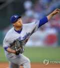 In this Associated Press photo, Ryu Hyun-jin of the Los Angeles Dodgers throws a pitch against the Los Angeles Angels at Angel Stadium of Anaheim on June 28, 2017. (Yonhap)