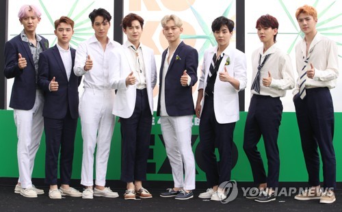 K-pop boy band EXO poses for the camera during a publicity event for its fourth album, "The War," at Grand Walkerhill hotel in Seoul on July 18, 2017. (Yonhap)