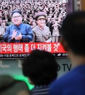 A handful of people paused at a train station in Seoul on Tuesday to watch coverage of North Korea’s threats to launch missiles into waters near Guam. Credit Lee Jin-Man/Associated Press