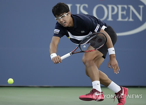 In this photo taken by the Associated Press on Aug. 30, 2017, South Korean tennis player Chung Hyeon competes against John Isner of the United States during their second round men's singles match at the U.S. Open at Billie Jean King National Tennis Center in New York. (Yonhap)
