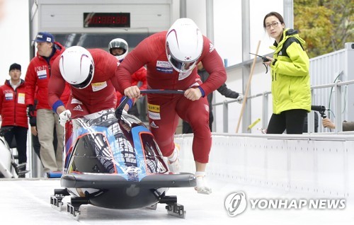 This file photo taken Oct. 18, 2017, shows South Korean bobsleigh team of Won Yun-jong and Seo Young-woo making a practice run at the Olympic Sliding Centre in PyeongChang, Gangwon Province. (Yonhap)