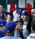 In this Associated Press photo from June 18, 2018, Choo Shin-soo of the Texas Rangers is congratulated by teammates after hitting a solo shot against the Kansas City Royals in the top of the first inning of a major league regular season game at Kauffman Stadium in Kansas City, Missouri. (Yonhap)