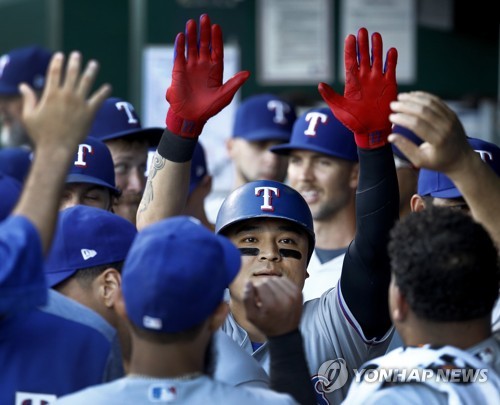 In this Associated Press photo from June 18, 2018, Choo Shin-soo of the Texas Rangers is congratulated by teammates after hitting a solo shot against the Kansas City Royals in the top of the first inning of a major league regular season game at Kauffman Stadium in Kansas City, Missouri. (Yonhap)