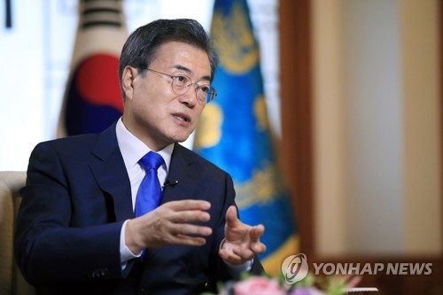 In the photo provided by South Korea's presidential office Cheong Wa Dae, President Moon Jae-in speaks in an interview with Russian news outlets at his office on June 20, 2018, one day before he was set to embark on a three-day state visit to Russia for a bilateral summit with Russian President Vladimir Putin. (Yonhap)