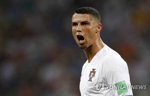 This photo taken by the Associated Press on June 30, 2018, shows Portugal's Cristiano Ronaldo reacting during the round of 16 match between Uruguay and Portugal at the 2018 FIFA World Cup at Fisht Stadium in Sochi, Russia. (Yonhap)