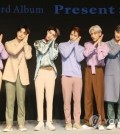 The seven GOT7 members pose for photos during a press conference on Sept. 17, 2018. (Yonhap)