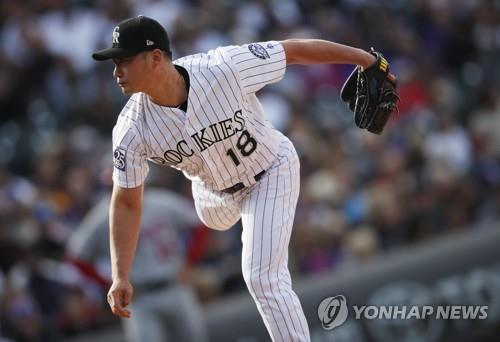 In this Associated Press photo, Oh Seung-hwan of the Colorado Rockies throws a pitch against the Washington Nationals in the top of the eighth inning of a Major League Baseball regular season game at Coors Field in Denver on Sept. 30, 2018. (Yonhap)