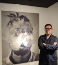 Photographer Hwang Pil-joo poses for photos after an interview with Yonhap News Agency at Gallery Benro in Seoul on Oct. 12, 2018. (Yonhap)